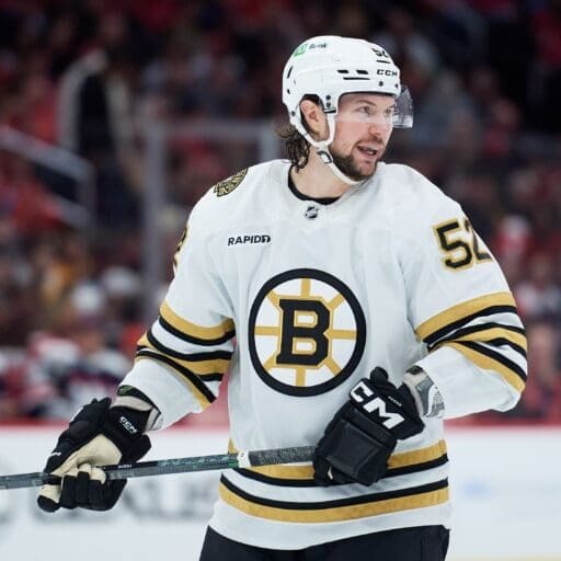 Mar 30, 2024; Washington, District of Columbia, USA; Boston Bruins defenseman Andrew Peeke (52) prepares for a face-off against the Washington Capitals during the second period at Capital One Arena. Mandatory Credit: Hannah Foslien-USA TODAY Sports